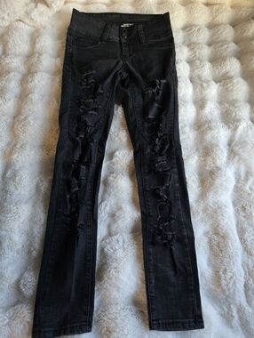 Black skinny destroyed jeans